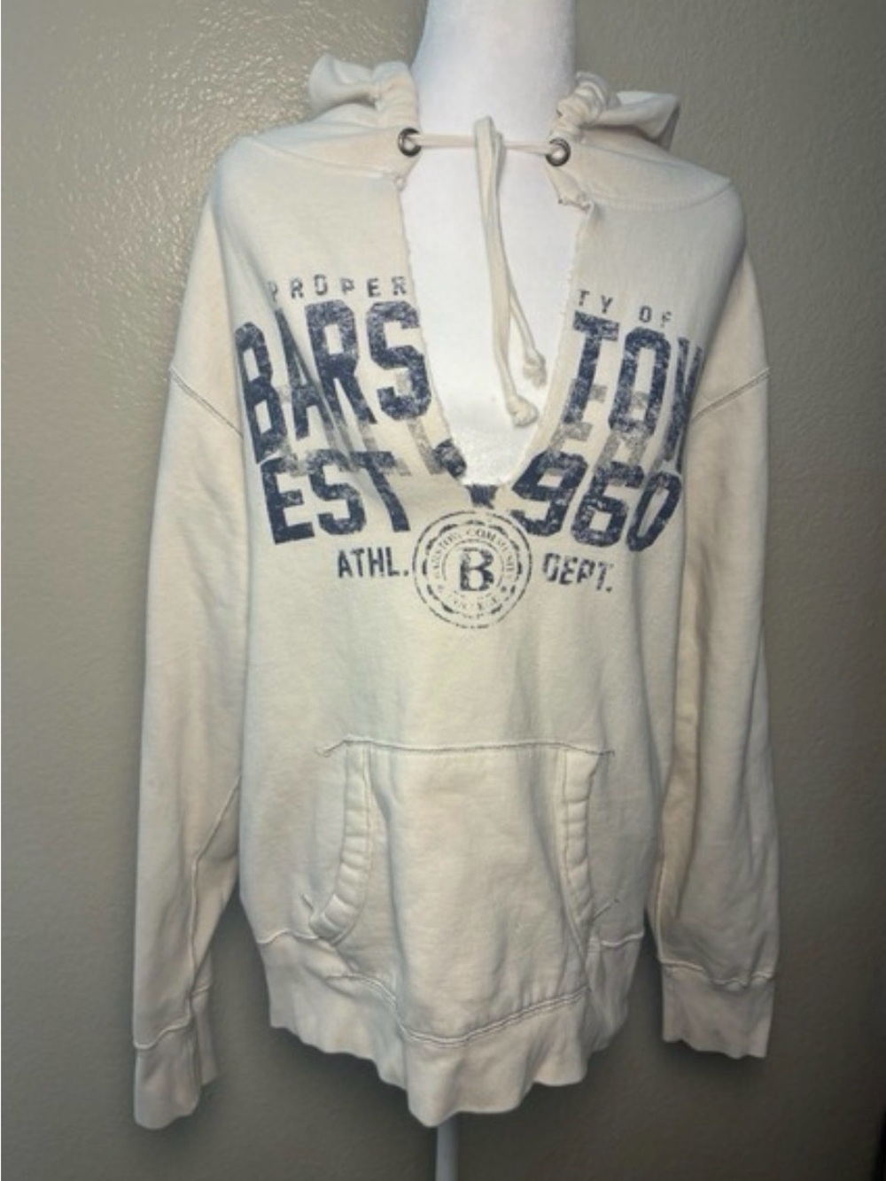 J. America Distressed Cream Hoodie with Faded Navy “Property of Barstow” Graphic